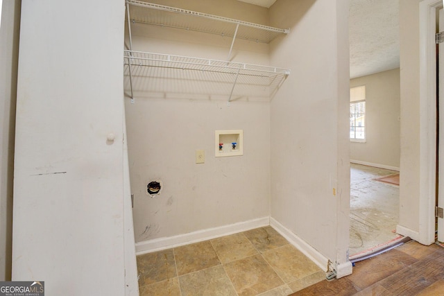 laundry room with washer hookup, hardwood / wood-style flooring, and electric dryer hookup