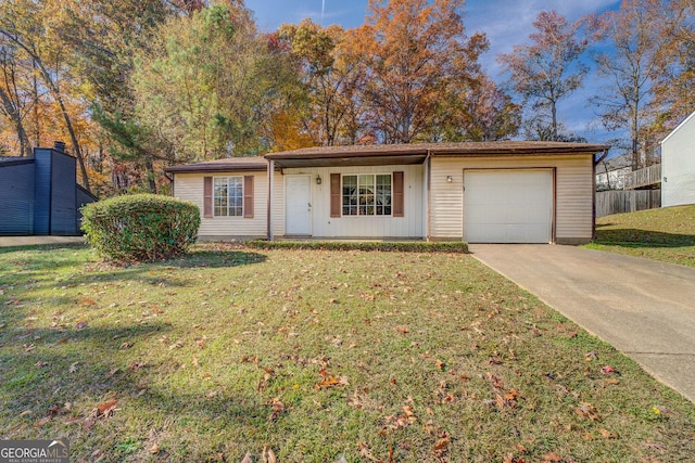 single story home with a front yard and a garage