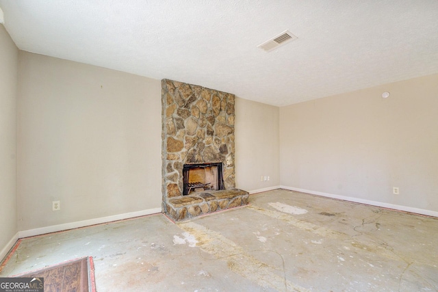 5267 Tasman Trl, Lithonia, GA 30038 - unfurnished living room featuring a stone fireplace and baseboards