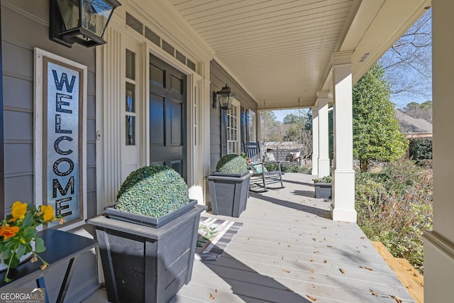 wooden terrace featuring a porch