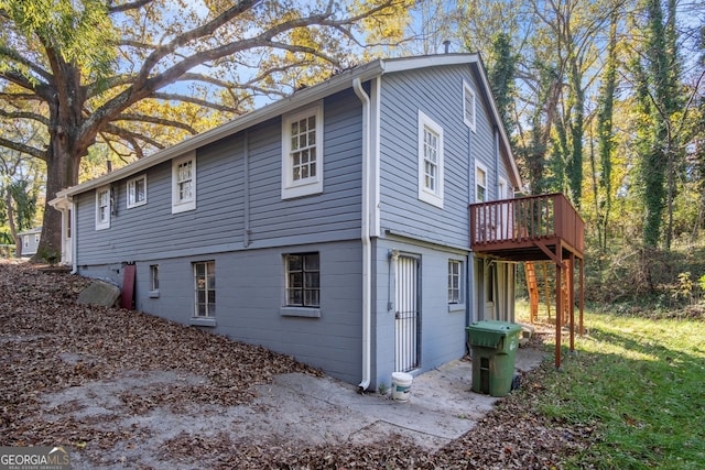 view of property exterior with a deck