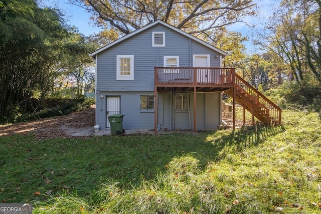 back of property featuring a wooden deck