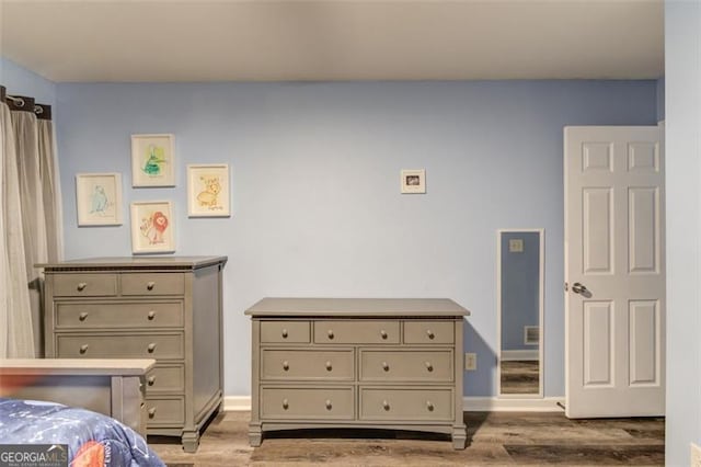 bedroom featuring light wood-type flooring