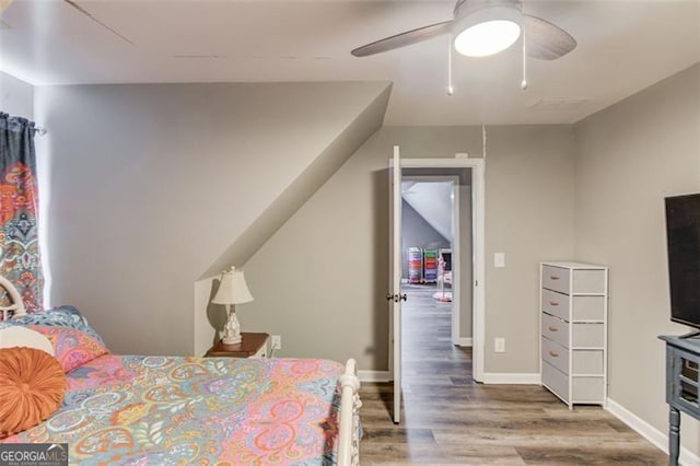 bedroom with wood-type flooring and ceiling fan