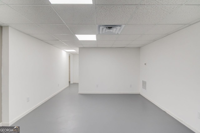 basement featuring a drop ceiling