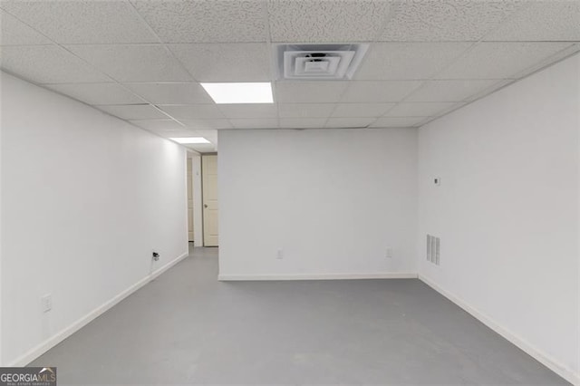 basement featuring a drop ceiling