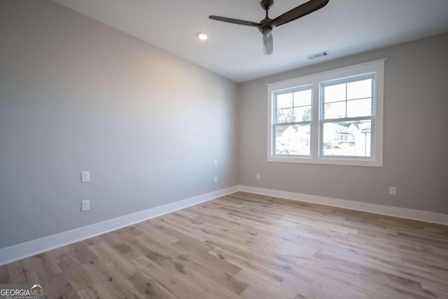 unfurnished room featuring ceiling fan and light wood-type flooring