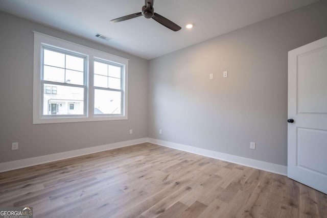 unfurnished room featuring ceiling fan and light hardwood / wood-style floors