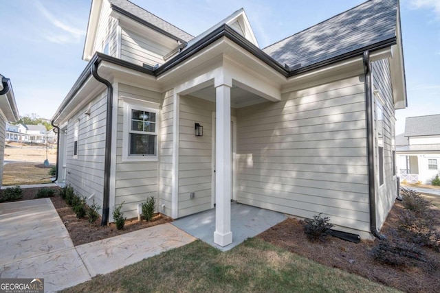 entrance to property featuring a patio