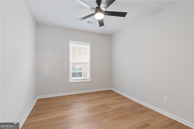 spare room featuring ceiling fan and light hardwood / wood-style floors