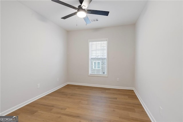 spare room featuring ceiling fan and light wood-type flooring