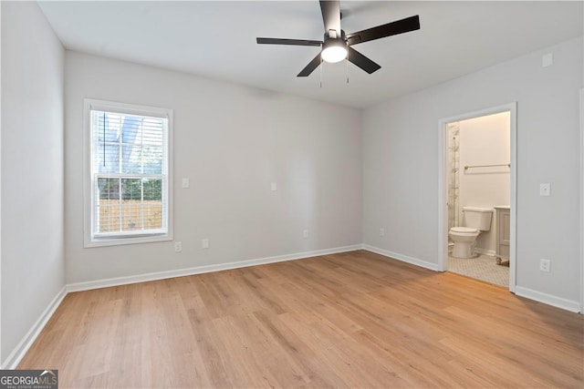 unfurnished bedroom with connected bathroom, light hardwood / wood-style flooring, and ceiling fan