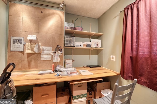 office space featuring a textured ceiling