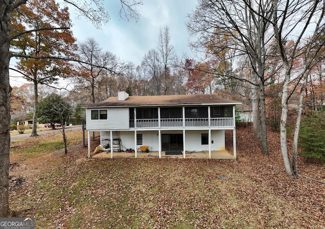 rear view of house with a sunroom