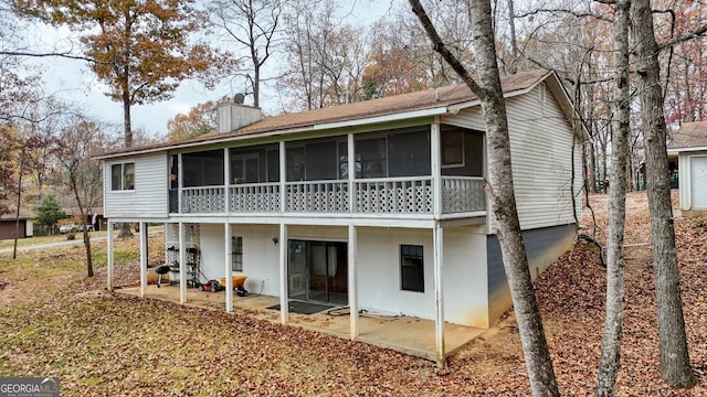 rear view of property featuring a patio