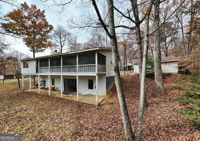 back of property featuring a patio area