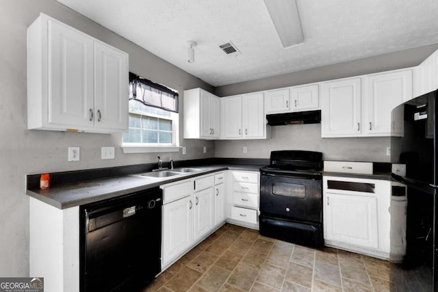 kitchen with sink, white cabinets, black appliances, and a textured ceiling