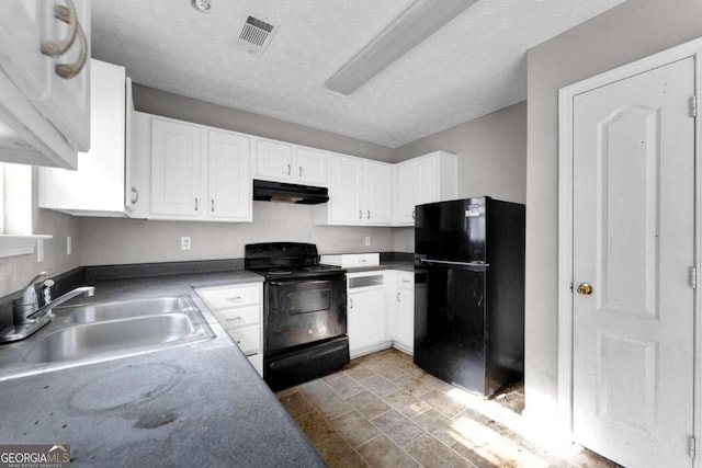 kitchen featuring white cabinetry, sink, black appliances, and a textured ceiling