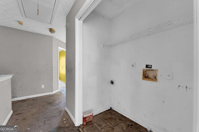 laundry area featuring hookup for a washing machine, a textured ceiling, and electric dryer hookup