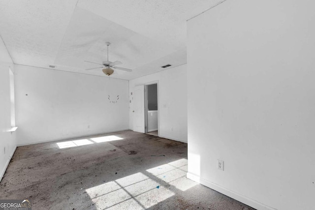 unfurnished room featuring ceiling fan and a textured ceiling