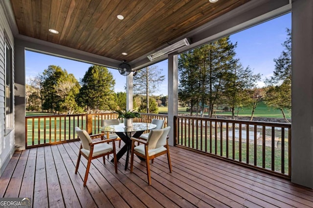 wooden deck featuring a yard