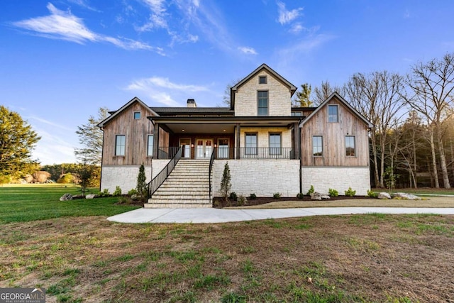 view of front facade with a front lawn and a porch