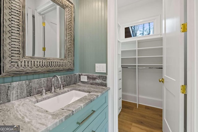 bathroom featuring hardwood / wood-style floors and vanity