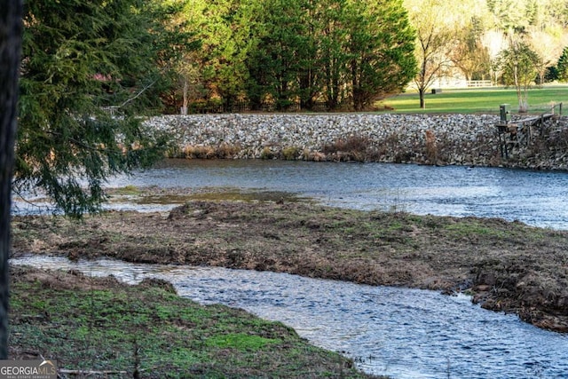 view of community with a water view