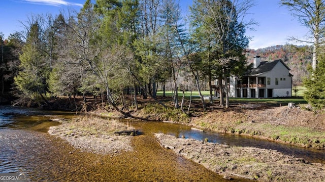 view of yard with a water view