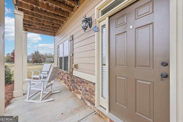 property entrance featuring covered porch