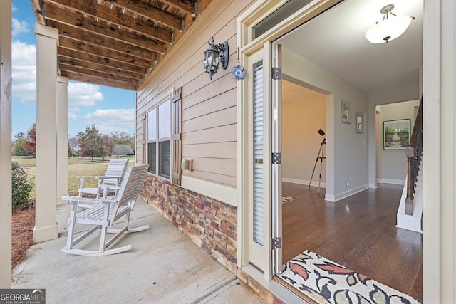 view of patio featuring a porch