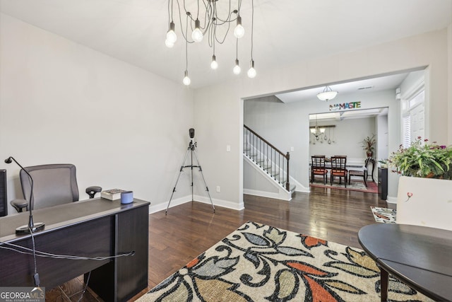 office featuring an inviting chandelier and dark wood-type flooring