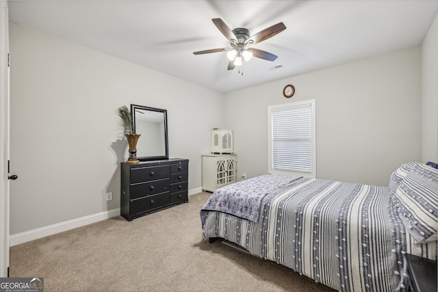 bedroom featuring ceiling fan and light colored carpet