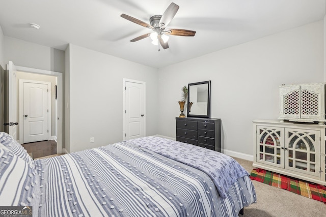 carpeted bedroom featuring ceiling fan