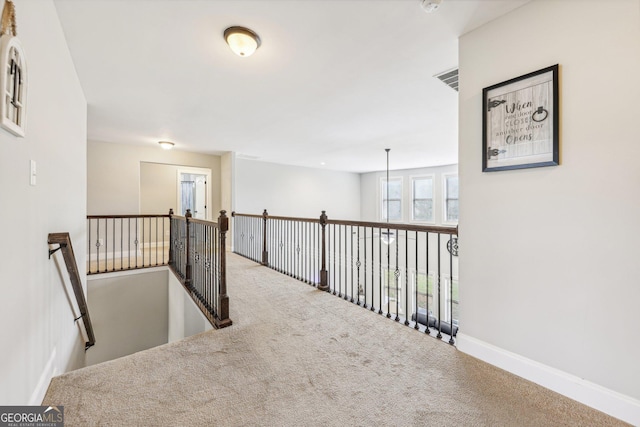 corridor with carpet floors