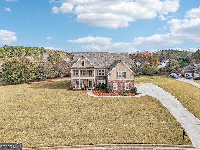 view of front facade with a front lawn and covered porch