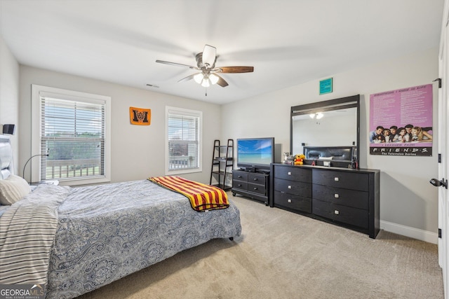 bedroom featuring ceiling fan and light colored carpet