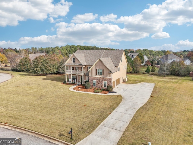 view of front of house featuring a front yard and a garage