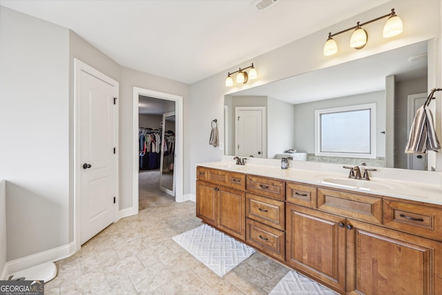 bathroom featuring tile patterned flooring and vanity