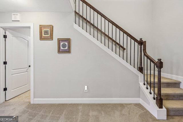 staircase with carpet floors