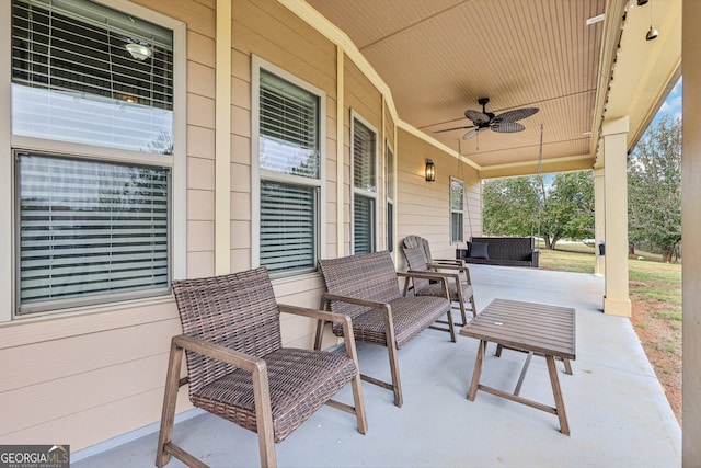 view of patio with ceiling fan and a porch