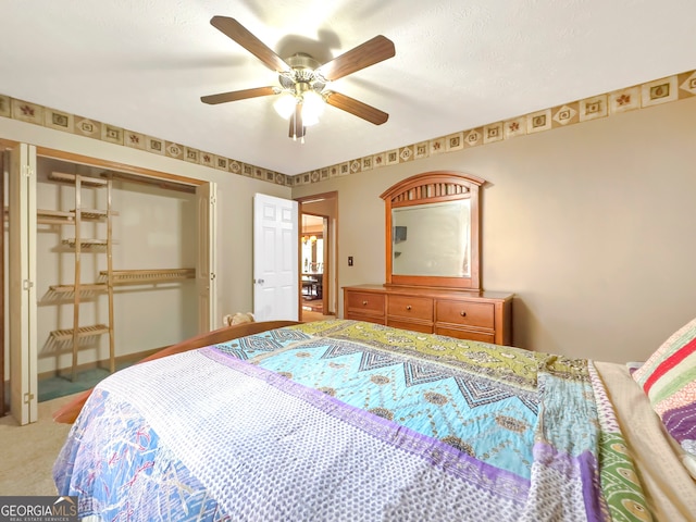 bedroom featuring carpet floors, a closet, and ceiling fan