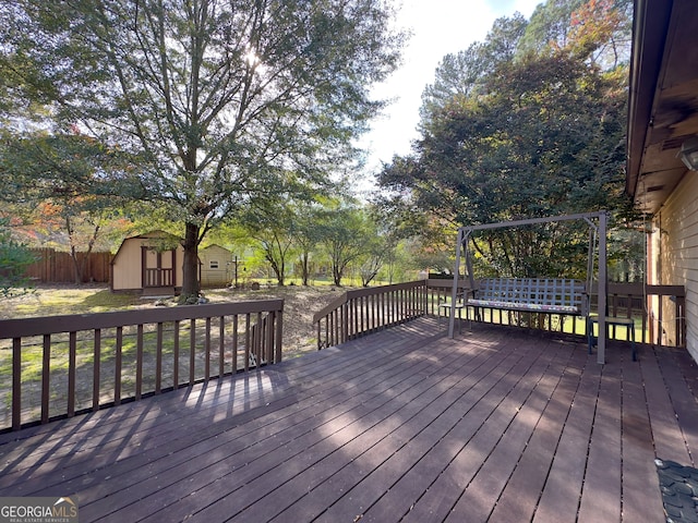 wooden terrace with a shed