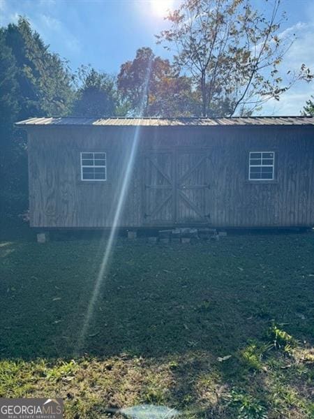 view of side of home with an outbuilding