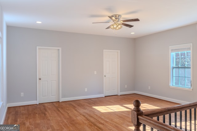 unfurnished bedroom featuring ceiling fan and light wood-type flooring