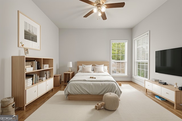 bedroom featuring ceiling fan and wood finished floors