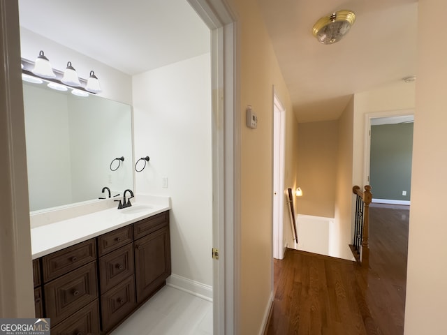 bathroom featuring hardwood / wood-style floors and vanity