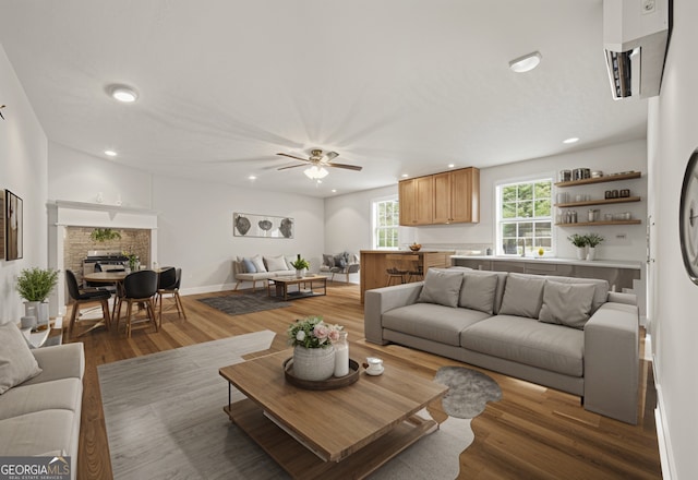 living area featuring recessed lighting, a ceiling fan, and wood finished floors