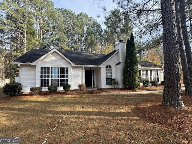 single story home with a front yard