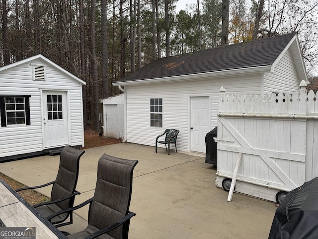 view of patio / terrace featuring an outbuilding